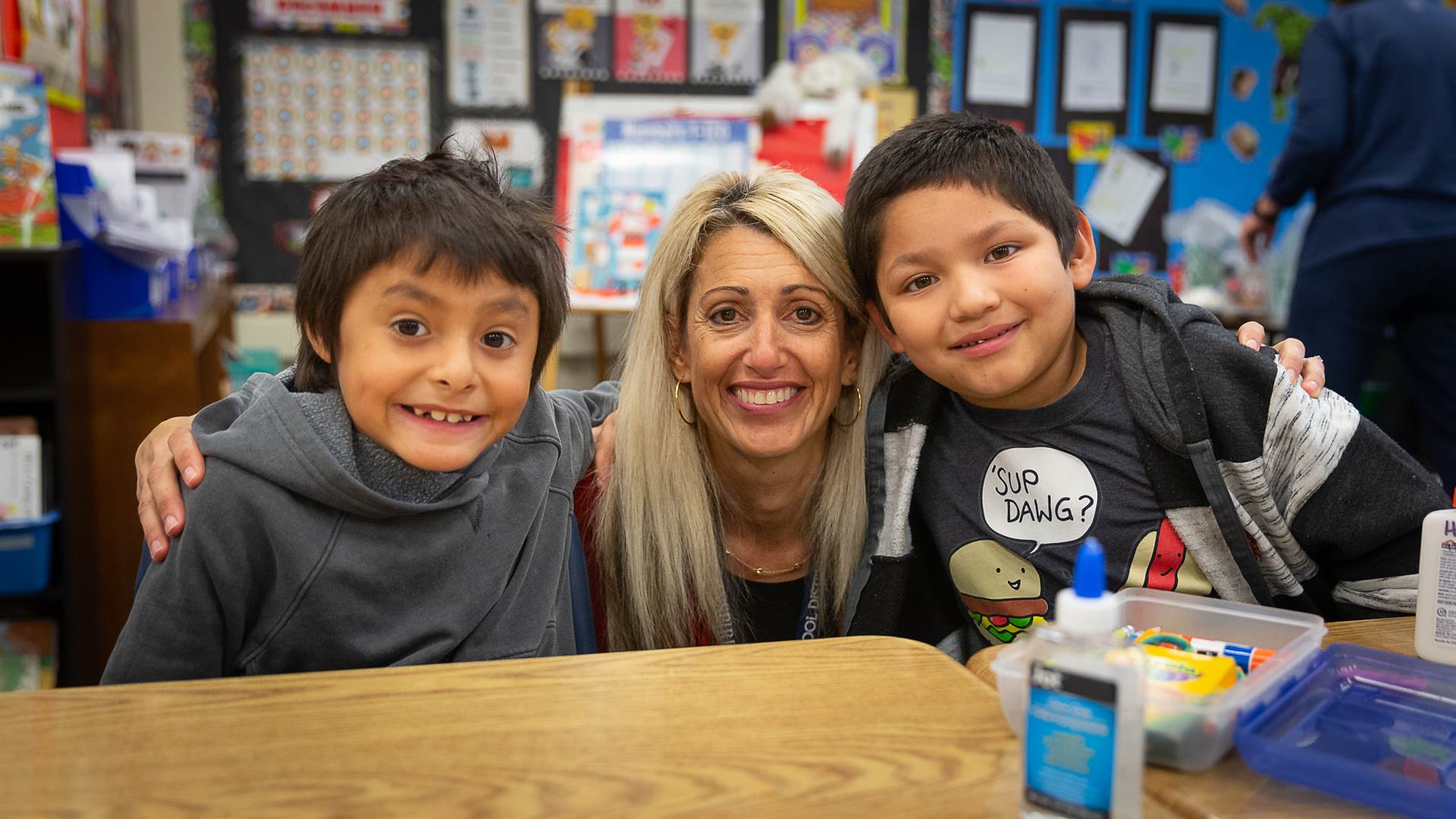 Teacher and students smiling