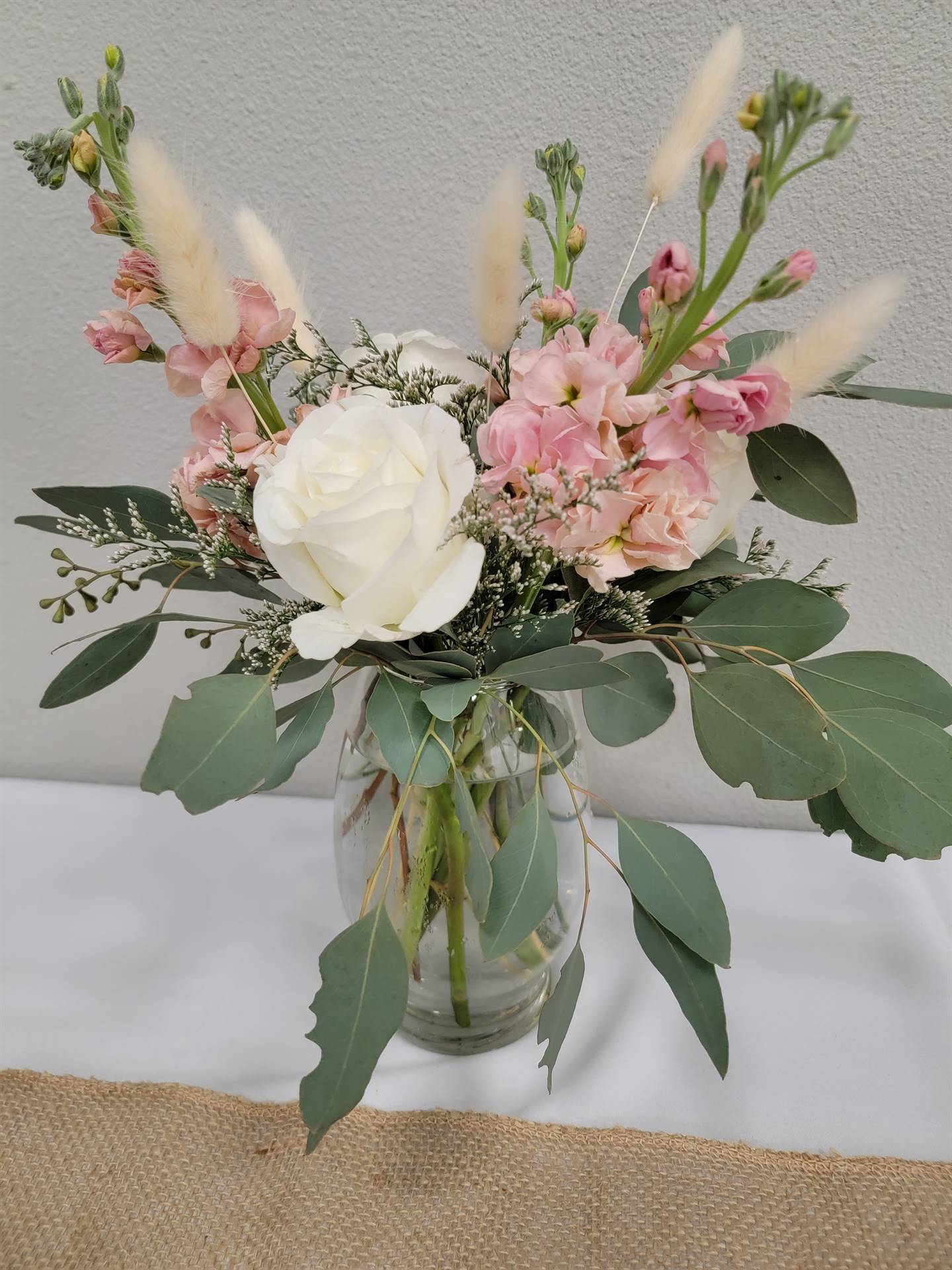 white, pink and green floral arrangement