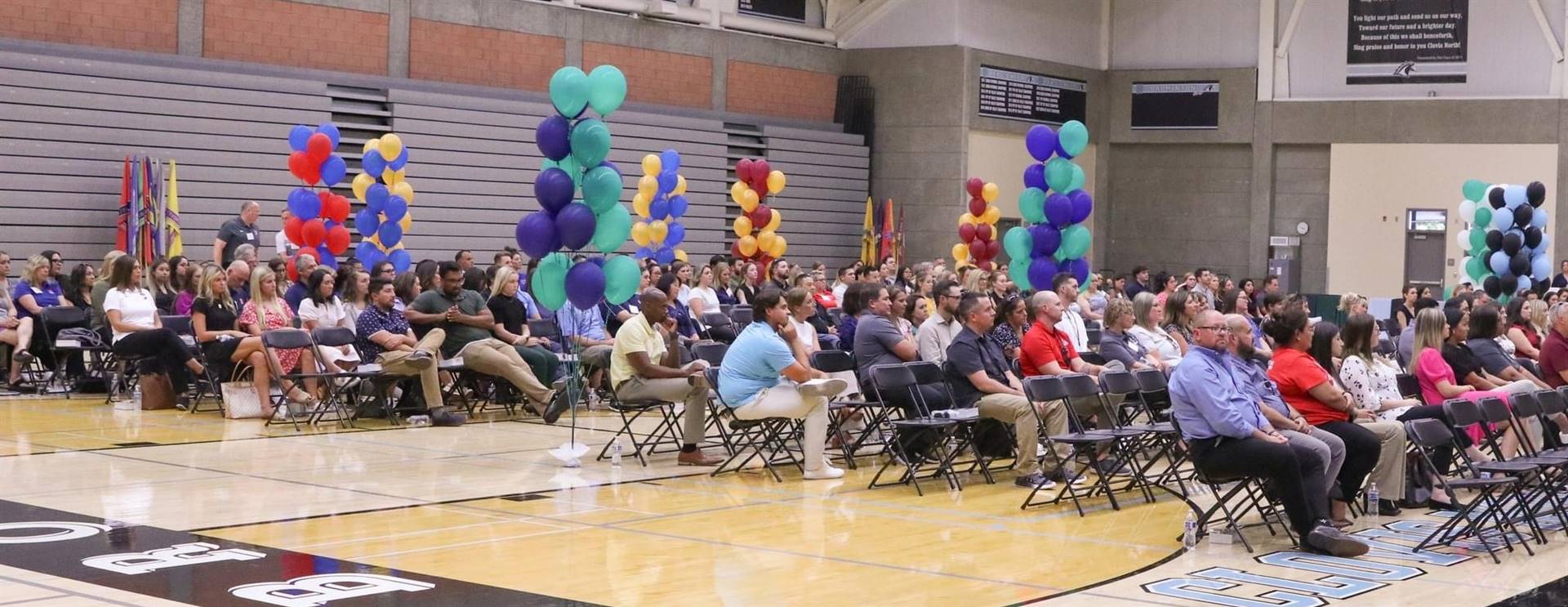 CNHS Gym with audience seating and balloon pillars