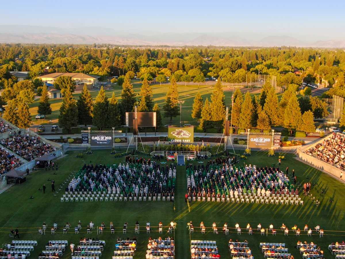 Drone photo students graduating in stadium
